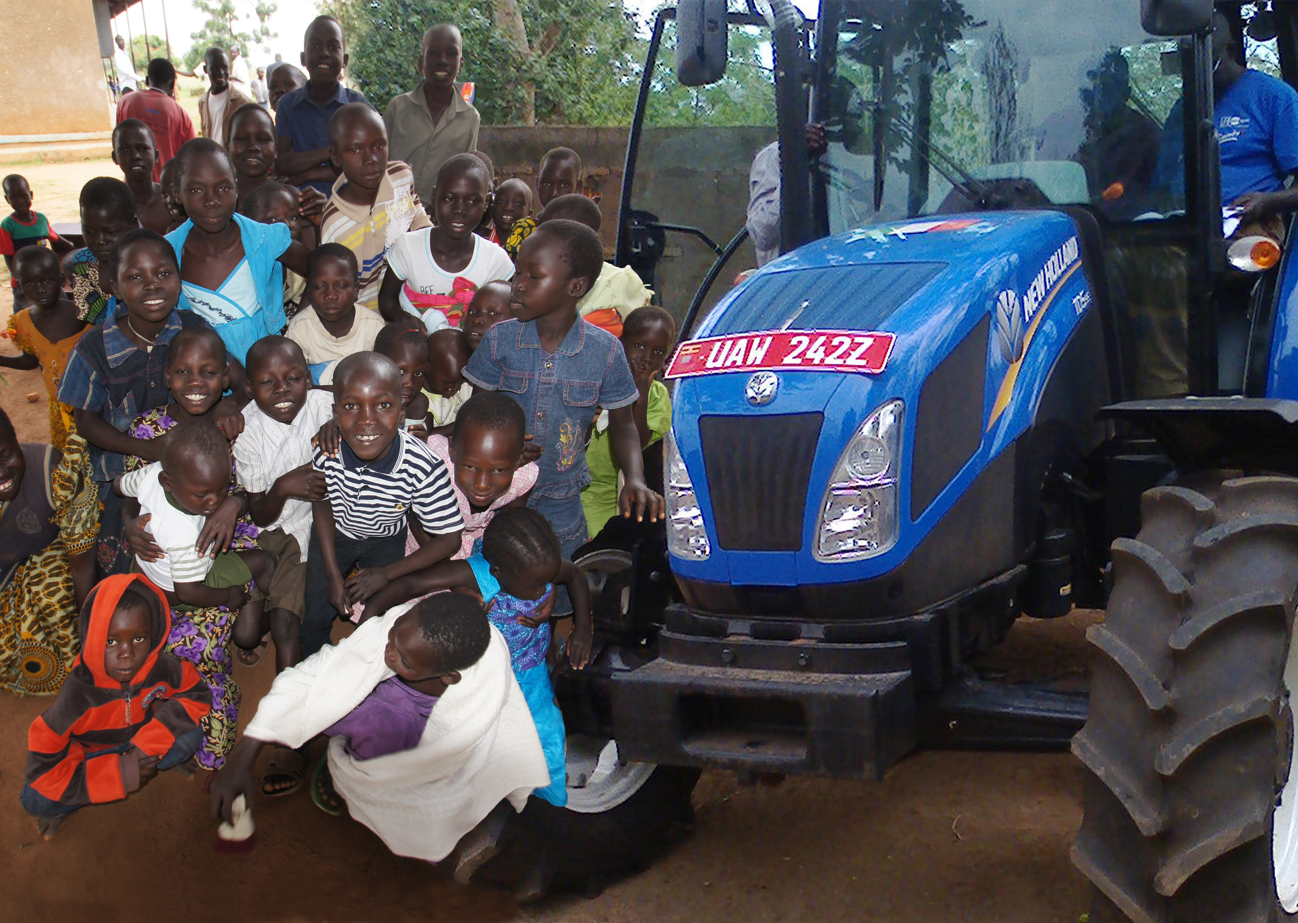 NEW HOLLAND DONATES A TD5 TRACTOR TO SUPPORT FATHER NATALINO’S MISSIONARY PROJECT IN THE AURA DIOCESE IN NORTHERN UGANDA